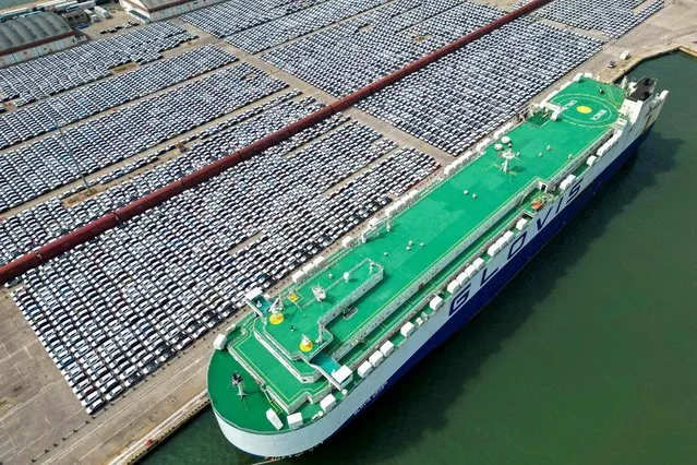 This aerial photo taken on June 1, 2023 shows rows of cars that will be exported at Yantai port, in China's eastern Shandong province. (Photo by AFP Photo/China Stringer Network)