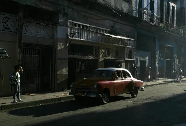 A vintage Chevrolet is driven down a street in Old Havana, September 2006. (Photo by Jorge Silva/Reuters)