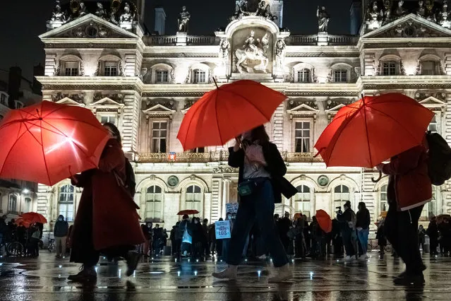 More than one hundred people holding a red umbrella gathered in Lyon, place des Terreaux, as part of the International Day for the Elimination of Violence against Sеx Workers in Lyon, France on December 17, 2020. (Photo by Konrad K./SIPA Press/Rex Features/Shutterstock)