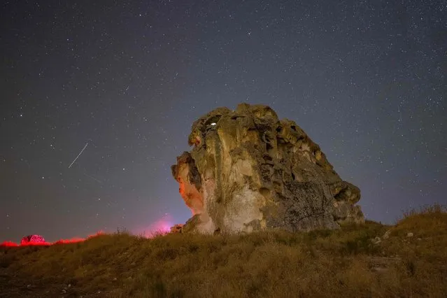 This photograph taken on on August 12, 2023, shows a view of the sky during the Perseid meteor shower over the historical Phrygian Valley near Ihsaniye, in the Afyonkarahisar district. (Photo by Yasin Akgul/AFP Photo)