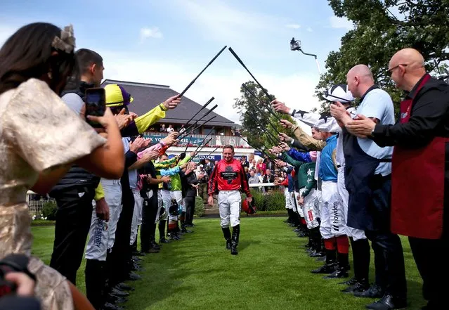 Jockey Paul Hanagan receives a guard of honour in the parade ring before he rides in the Sky Bet Handicap, his last race before retirement, on day three of the Sky Bet Ebor Festival at York Racecourse on Friday, August 25, 2023. (Photo by Simon Marper/PA Images via Getty Images)