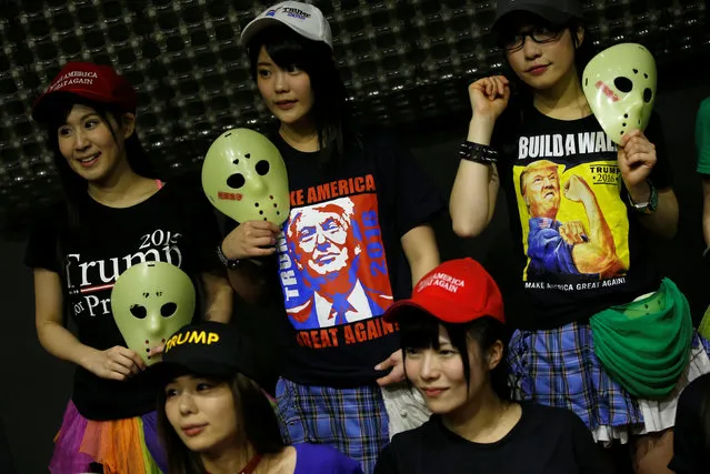Members of Japanese idol group Kamen Joshi (Masked Girls) in attires featuring images or names of U.S. President-elect Donald Trump, pose for a photo after their concert at their theatre in Tokyo's Akihabara district, Japan, December 12, 2016. (Photo by Toru Hanai/Reuters)