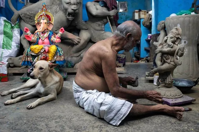 Haripad Pal, a famous veteran idol artist of Shankharibazar, Dhaka, is busy making idols ahead of the upcoming Ganesh Puja on September 18, 2023. (Photo by Md. Rakibul Hasan/ZUMA Press Wire)
