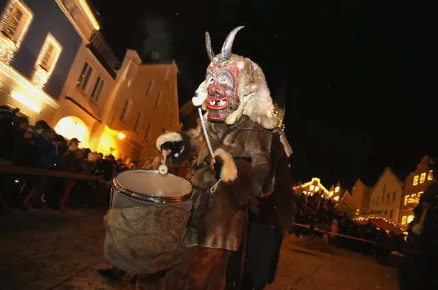 Locals dressed as “Perchten”, a traditional demonic creature in German and Austrian Alpine folklore, parade through the town center during the annual “Rauhnacht” gathering on January 5, 2017 in Waldkirchen, Germany. (Photo by Johannes Simon/Getty Images)