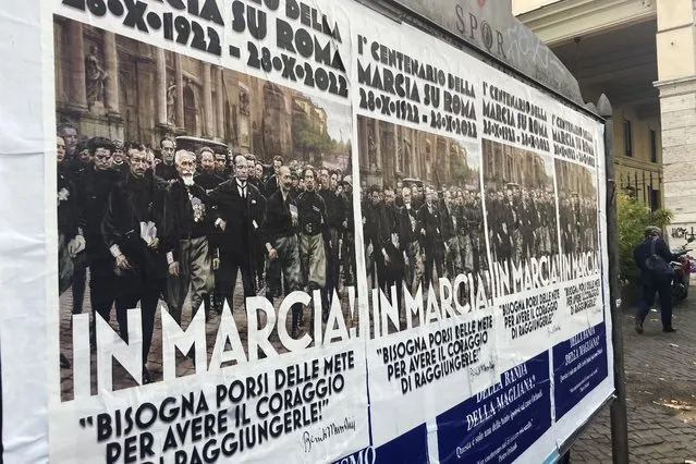 Posters commemorating the 100th anniversary of the March on Rome bearing a picture of Italian Fascist Dictator Benito Mussolini reading: “Marching!” with a quote by Mussolini “you have to set yourself goals to have the courage to reach them” are posted on the Rome's public billboard space, Thursday, October 27, 2022. The posters were later ordered removed by Rome's Mayor Roberto Gualtieri. (Photo by Gregorio Borgia/AP Photo)
