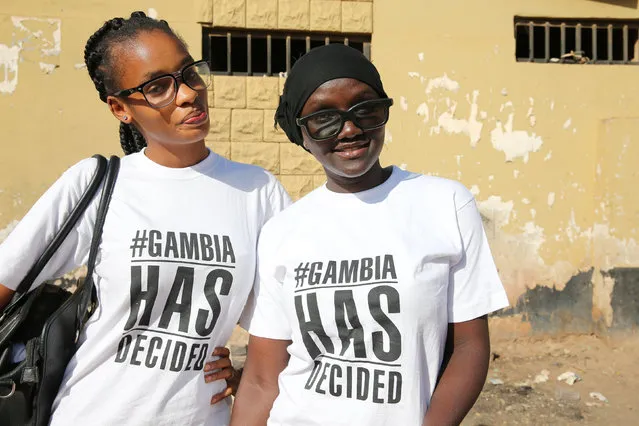 Activists pose along a street in Banjul, Gambia January 21, 2017. Gambia's President Yahya Jammeh, who for weeks had refused to step down after losing the recent election, has confirmed that he has decided to relinquish power. (Photo by Afolabi Sotunde/Reuters)