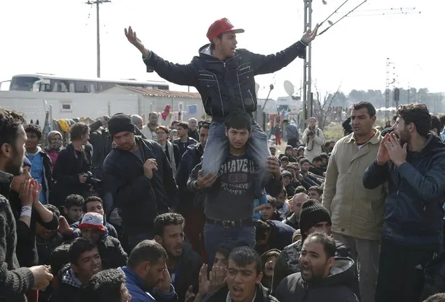 Migrants shout slogans as they block the railway track at the Greek-Macedonian border, near the village of Idomeni, Greece March 3, 2016. (Photo by Marko Djurica/Reuters)