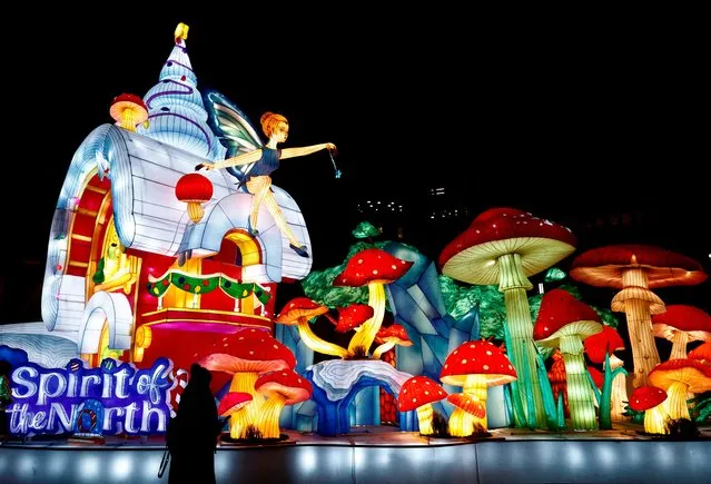 A person walks past huge lanterns displayed as part of the “Spirit of the North” winter wonderland experience in Brussels, Belgium on December 10, 2022. (Photo by Yves Herman/Reuters)