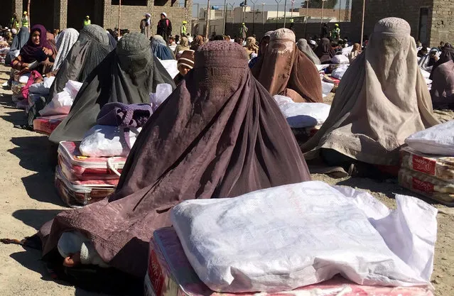 Afghan families receive winter aid from Islamic charity Ummah Welfare Trust in Kandahar, Afghanistan, 18 February 2016. Although Afghanistan's economy has reportedly improved, the country still relies on foreign aid for more than 90 per cent of national income, and ongoing unrest which has increased with the partial withdrawal of foreign troops January 2015 has further damaged potential for economic growth. (Photo by Muhammad Sadiq/EPA)