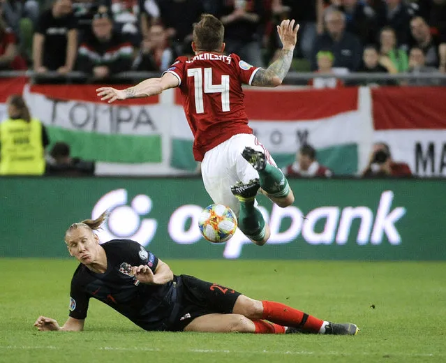 Gergo Lovrencsics, right, of Hungary and Domagoj Vida of Croatia in action during the UEFA EURO 2020 qualifying soccer match between Hungary and Croatia in Groupama Arena in Budapest, Hungary, Sunday, March 24, 2019. (Photo by Balazs Czagany/MTI via AP Photo)