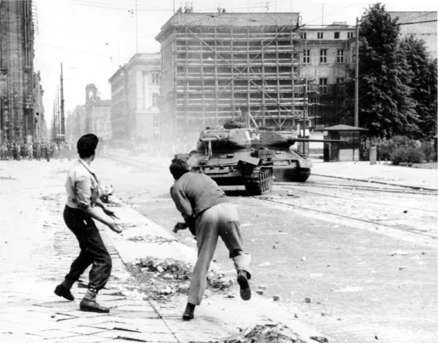 Two demonstrators hurl stones at Soviet tanks on Leipziger Platz in East Berlin, Germany on June 17, 1953. Germany's parliament on Friday, June 16, 2023, commemorated the 70th anniversary of a popular uprising in the communist east that was brutally crushed by the Soviet-backed dictatorship.(Photo by AP Photo, File)