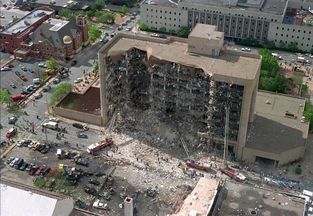 In this April 19, 1995, aerial file photo, the north side of the Alfred P. Murrah Federal Building in Oklahoma City is pictured after an explosion that killed 168 people and injured hundreds. As part of the city's annual day of remembrance Friday, April 19, 2019, – the 24th anniversary of the attack – civic leaders will plant a tree that was cloned from the Survivor Tree – a scarred American elm that survived the deadliest act of domestic terrorism on U.S. soil. (Photo by AP Photo/File)