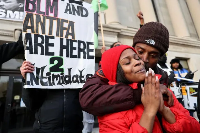 People react outside the Kenosha County Courthouse, during jury deliberations for Kyle Rittenhouse's trial, in Kenosha, Wisconsin, U.S., November 16, 2021. (Photo by Evelyn Hockstein/Reuters)