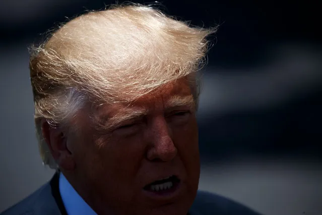 US President Donald J. Trump responds to a question from the news media as he walks to board Marine One on the South Lawn of the White House in Washington, DC, USA, 11 June 2019. President Trump is traveling to Iowa to attend a renewable energy event and the Republican Party of Iowa annual dinner. (Photo by Shawn Thew/EPA/EFE)