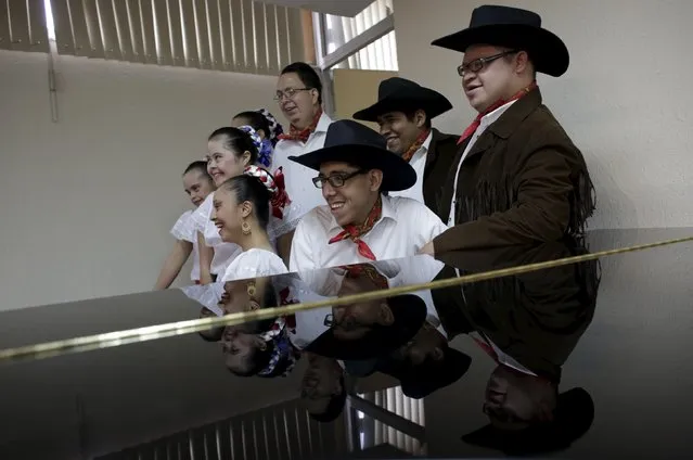 People with Down syndrome pose for a photo before a presentation in Monterrey, Mexico, April 14, 2016. The association “Abrazame con Discapacidad” (“Embrace me with Disabilities”) teaches folk dance to low-income people with Down syndrome and manages presentations at public events where they receive a payment, as part of a therapy that helps improve their motor system, learning and self-esteem, the association said. (Photo by Daniel Becerril/Reuters)