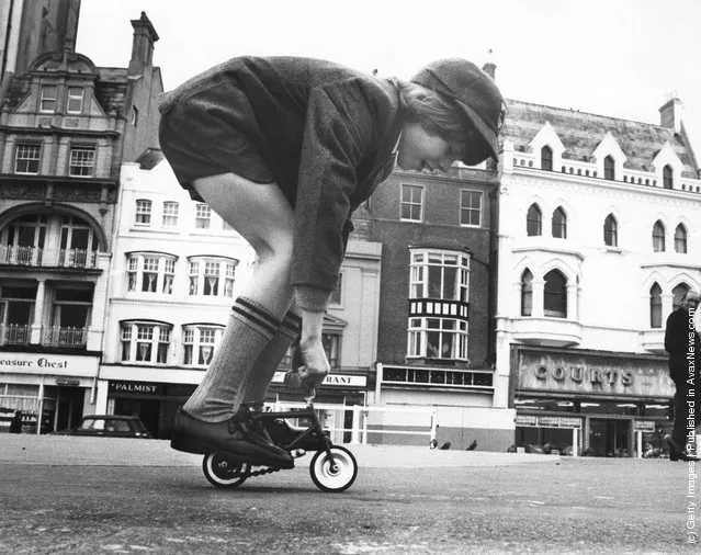 1975: Barry Lapworth of Hastings cycles on a miniature bicycle along the seafront