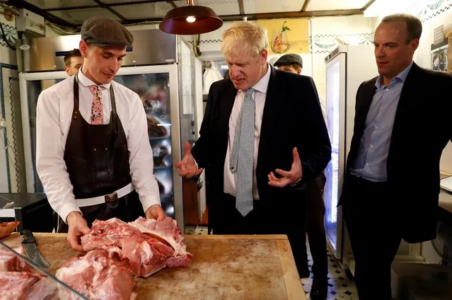 Boris Johnson, a leadership candidate for Britain's Conservative Party, and Britain's former Brexit Minister Dominic Raab visit a butcher's shop in Oxshott, Surrey, Britain, June 25, 2019. (Photo by Peter Nicholls/Reuters)