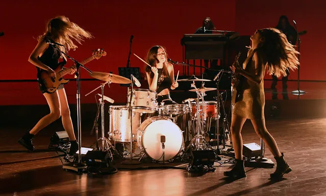 In this image released on March 14, Este Haim, Daneille Haim, and Alana Haim of HAIM perform onstage during the 63rd Annual GRAMMY Awards at Los Angeles Convention Center in Los Angeles, California and broadcast on March 14, 2021. (Photo by Kevin Winter/Getty Images for The Recording Academy)