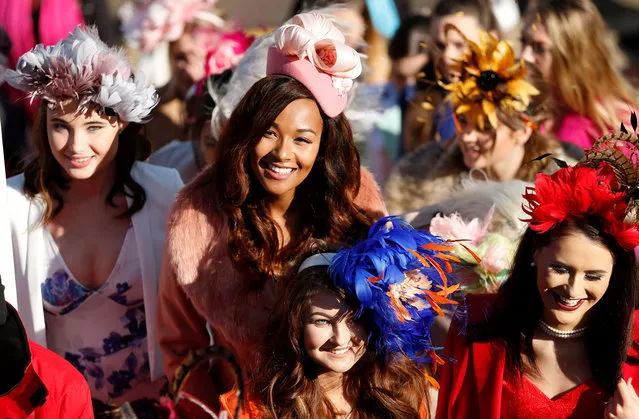 Racegoers in fashionable hats attend Ladies Day at Cheltenham Festival on March 15, 2017 in Cheltenham, England. (Photo by Andrew Boyers/Reuters)