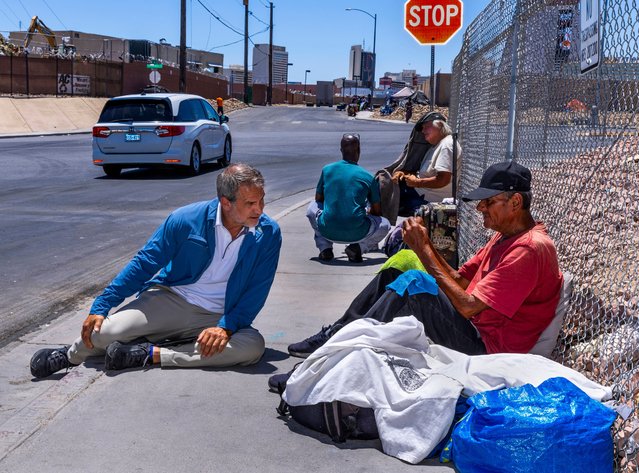 Dave Marlon, president of Vegas Stronger, a non-profit offering healthcare, talks to a homeless man as he and their street team offer services including a list of local cooling stations in Las Vegas, US on June 6, 2024. (Photo by L.E. Baskow/AP Photo)