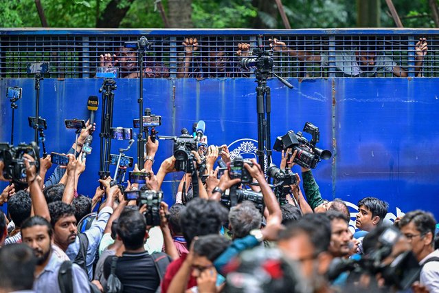 Protesters are being detained in a police van while protesting outside the High Court building as they demand justice for the victims arrested and killed in the recent countrywide violence in Dhaka on July 31, 2024. Bangladesh's government called for a day of mourning on July 30 for victims of violence in nationwide unrest, but students denounced the gesture as disrespectful of classmates killed during clashes with police this month. (Photo by Munir Uz Zaman/AFP Photo)