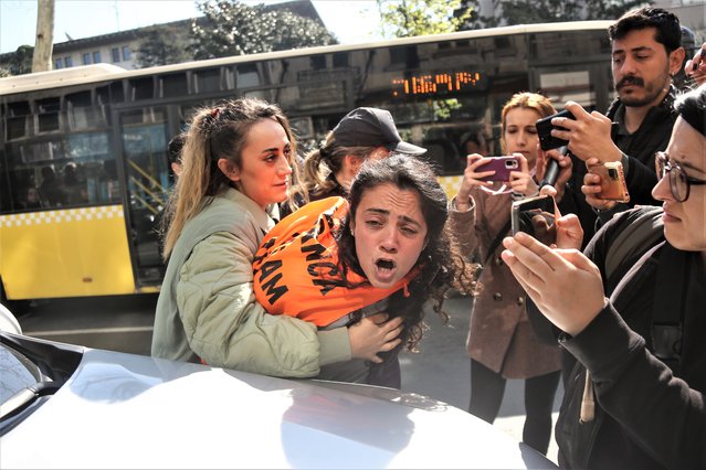 Bystanders film as a protester is detained during a May Day march in Istanbul, Turkey on May 1, 2023. (Photo by Dia Images via Getty Images)