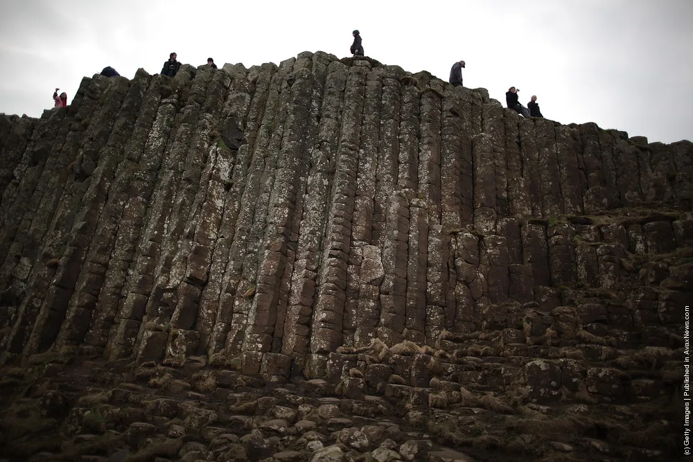 Visitors Enjoy the Ancient Basalt Columns that form the Giants Causeway