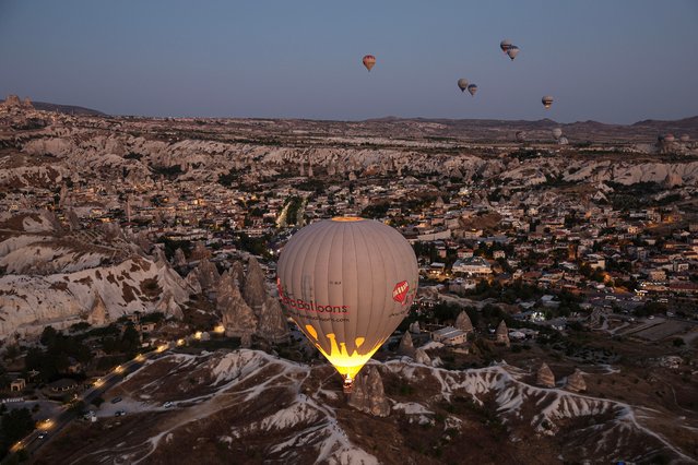 At the “Cappadocia Balloon and Culture Road Festival” organized by the Ministry of Culture and Tourism, 35 balloons with different figures brought from 17 countries colored the sky on August 8, 2024 in Nevsehir, Türkiye. (Photo by Ugur Yildirim/ diaimages via Getty Images)