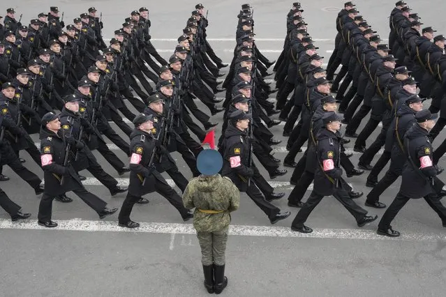 Troops march during a rehearsal for the Victory Day military parade which will take place at Dvortsovaya (Palace) Square on May 9 to celebrate 77 years after the victory in World War II in St. Petersburg, Russia, Thursday, May 5, 2022. (Photo by Dmitri Lovetsky/AP Photo)