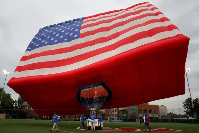 The America One U.S flag hot air balloon is raised in honour of Flag Day at Stevens Institute of Technology in Hoboken, New Jersey, U.S., June 14, 2017. (Photo by Ashlee Espinal/Reuters)