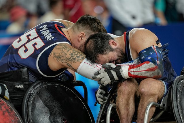 Mason Symons, left, and Chuck Aoki of the U.S. hug to console each other after loosing the wheelchair rugby gold medal match between Japan and the U.S. at the 2024 Paralympics, Monday, September 2, 2024, in Paris, France. (Photo by Aurelien Morissard/AP Photo)