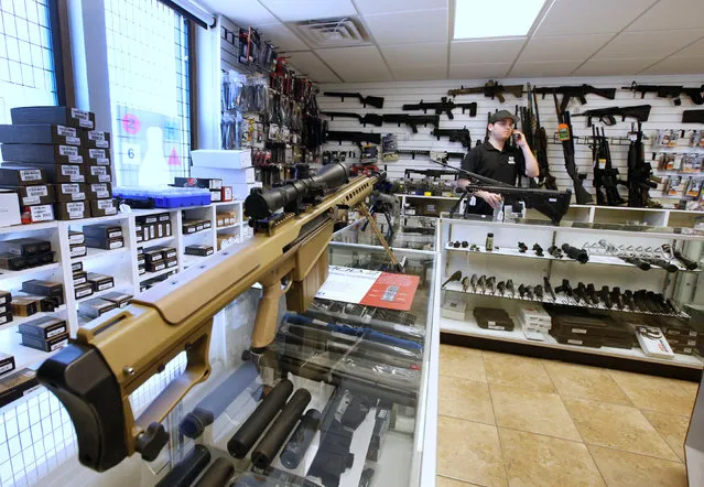 Sniper rifles sit on display for sale at the “Ready Gunner” gun store in Provo, Utah, U.S., June 21, 2016. (Photo by George Frey/Reuters)