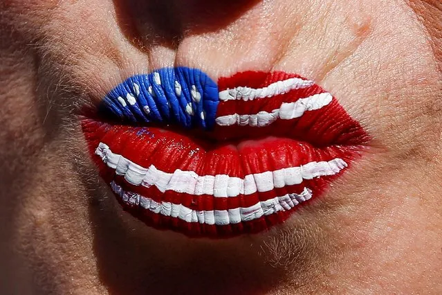 A woman displays her American flag-themed lips as people celebrate 4th of July at Coney Island in New York, U.S., July 4, 2022. (Photo by Eduardo Munoz/Reuters)