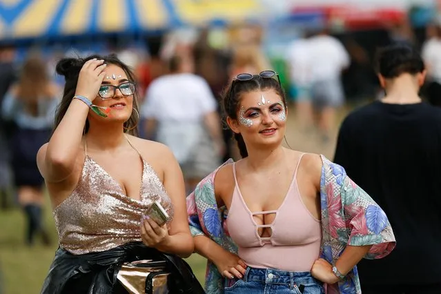 Fans arrive en-masse for the first day of Reading festival in the sunshine on August 25, 2017 in Reading, England. (Photo by SWNS: South West News Service)