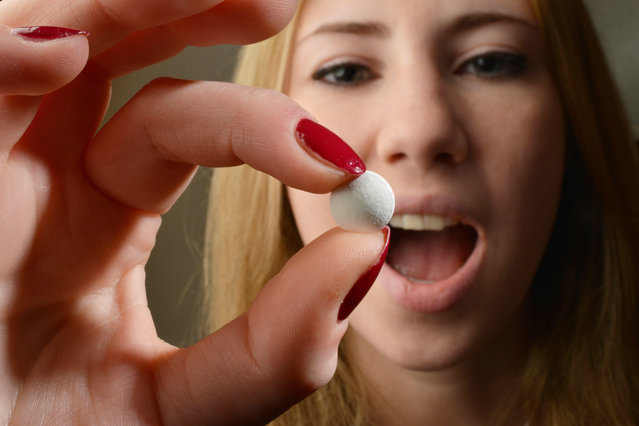 The symbol photo “medicine” shows a young woman in taking a tablet. (Photo by Alamy Stock Photo)