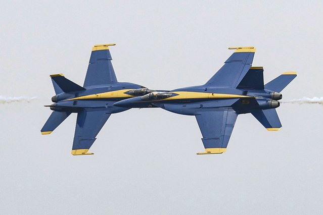 U.S. Navy Blue Angels pilots make a close pass while flying their F/A-18 Super Hornets over the Ohio River, Thursday, September 12, 2024, in Owensboro, Ky, during a practice for their upcoming weekend performance during the Owensboro Air Show. (Photo by Greg Eans/The Messenger-Inquirer via AP Photo)