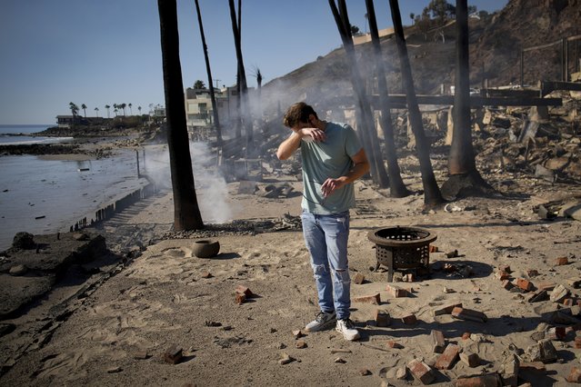 Luke Dexter reacts as he sifts through the remains of his father's fire-ravaged beach front property in the aftermath of the Palisades Fire Friday, January 10, 2025 in Malibu, Calif. (Photo by John Locher/AP Photo)