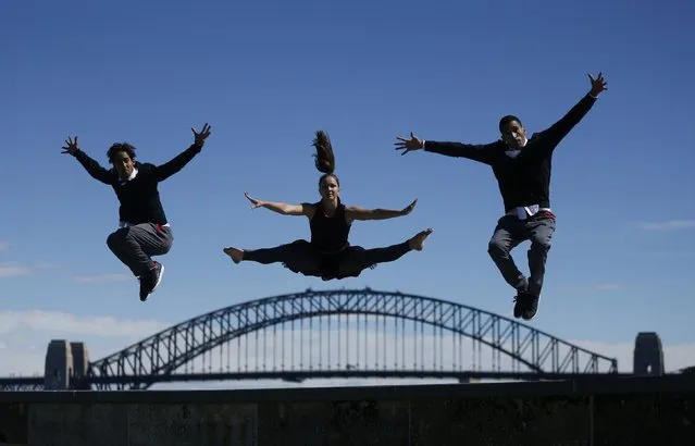 Members of the Red Bull Flying Bach dance troupe perform on Sydney Harbour's Fort Denison during a photo call, in Sydney September 9, 2014. The group, in Australia as part of their world tour, perform acrobatic dance to the classical music of German composer Johann Sebastian Bach with combined with electronic beats. Pictured are (L-R) Nordine-Dany Grimah, Anna Holmstrom and Yamine Manaa. (Photo by Jason Reed/Reuters)