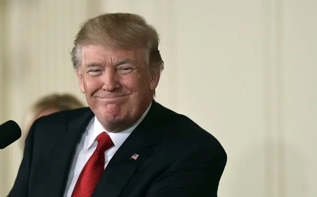 President Donald Trump smiles as he announces in the East Room of the White House in Washington, Thursday, October 12, 2017, that Kirstjen Nielsen, a cybersecurity expert and deputy White House chief of staff is his choice to be the next Homeland Security Secretary. (Photo by Susan Walsh/AP Photo)