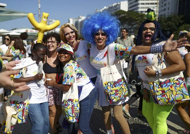 Volunteers take part in an event against HIV/AIDS along Copacabana beach in Rio de Janeiro, Brazil, ahead of the 2016 Rio Olympics, August 5, 2016. (Photo by Benoit Tessier/Reuters)