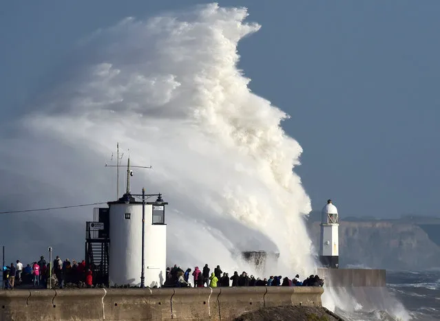 Waves crash over the lighthouse as storm Ophelia passes Porthcawl, Wales, Britain, October 16, 2017. (Photo by Rebecca Naden/Reuters)