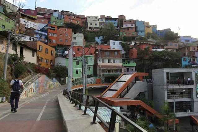 A man walks in the “Comuna 13” neighborhood in Medellin, Colombia September 8, 2015. (Photo by Fredy Builes/Reuters)
