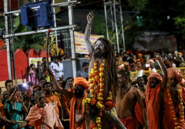 Naga Sadhus, or Hindu holy men, attend a procession before taking a dip in a holy pond during the second “Shahi Snan” (grand bath) at “Kumbh Mela”, or Pitcher Festival, in Trimbakeshwar, India, September 13, 2015. (Photo by Danish Siddiqui/Reuters)