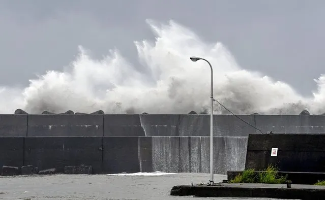 High waves hit the breakwater at a port in Aki, Kochi prefecture, southern Japan, Sunday, September 18, 2022, as a powerful typhoon approaching southern Japan on Sunday lashed the region with strong winds and heavy rain. (Photo by Kyodo News via AP Photo)