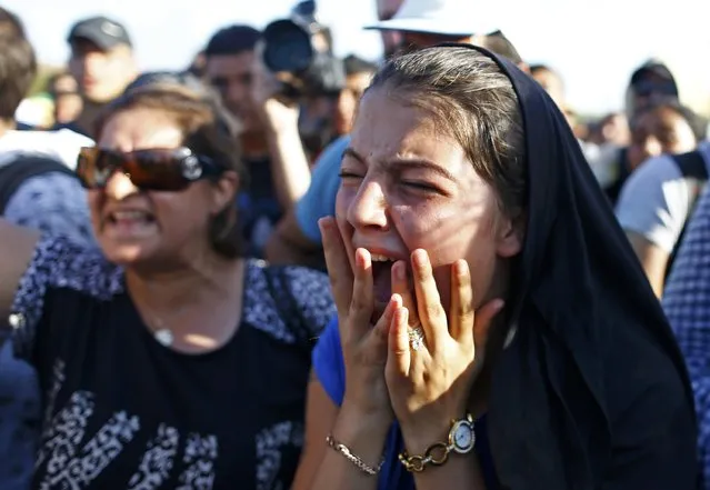 A woman cries as police blocks migrants from walking towards the Greece border on a highway near Edirne, Turkey, September 18, 2015. (Photo by Osman Orsal/Reuters)