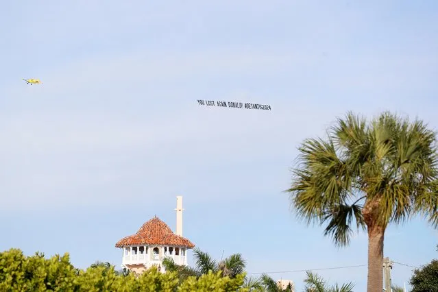 A plane tows a banner over the grounds of his Mar-a-Lago resort before former U.S. President Donald Trump makes an announcement in Palm Beach, Florida, U.S., November 15, 2022. (Photo by Octavio Jones/Reuters)