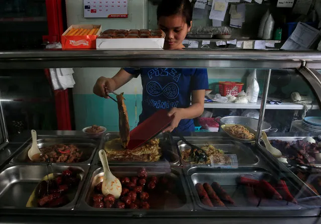 A worker prepares an order at a small restaurant in Metro Manila, Philippines, August 4, 2016. (Photo by Romeo Ranoco/Reuters)