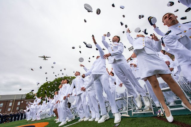 Newly commissioned officers toss their hats during the US Coast Guard Academy's 144th Commencement in New London, Connecticut, on May 21, 2025. (Photo by Joseph Prezioso/AFP Photo)