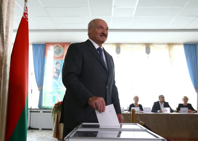 Belarussian President Alexander Lukashenko casts his ballot during a parliamentary election at a polling station in Minsk, Belarus September 11, 2016. (Photo by Vasily Fedosenko/Reuters)