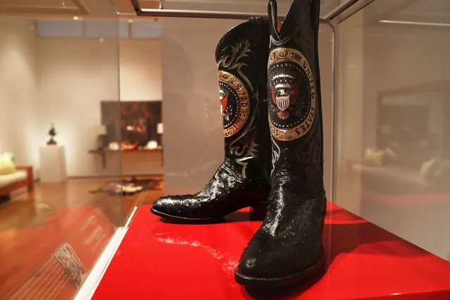 A pair of Ronald Reagan's cowboy boots sit in a case at Christie's where items from the former president and Nancy Reagan's California home are to be auctioned shortly on September 16, 2016 in New York City. Many personal items of the first couple are to be auctioned including "Hollywood Regency"style furniture and light fixtures, decorative works, handbags, porcelain stamped with the presidential seal, jewelry and a pair of Reagan's cowboy boots with the presidential seal. The e-catalog auction, which is expected to generate more than $2 million with individual items ranging from $1,000 to $50,000, goes live at Christie's Monday in New York. Proceeds from the auction will be donated to the Ronald Reagan Presidential Foundation and Institute. (Photo by Spencer Platt/Getty Images)